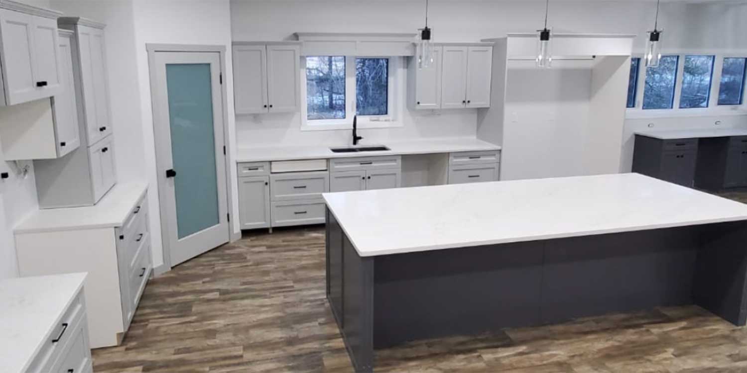 Kitchen with white quartz countertops, converted and installed by Parkside Quartz, Manitoba