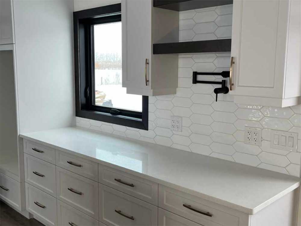 Kitchen with white quartz countertops, converted and installed by Parkside Quartz, Manitoba